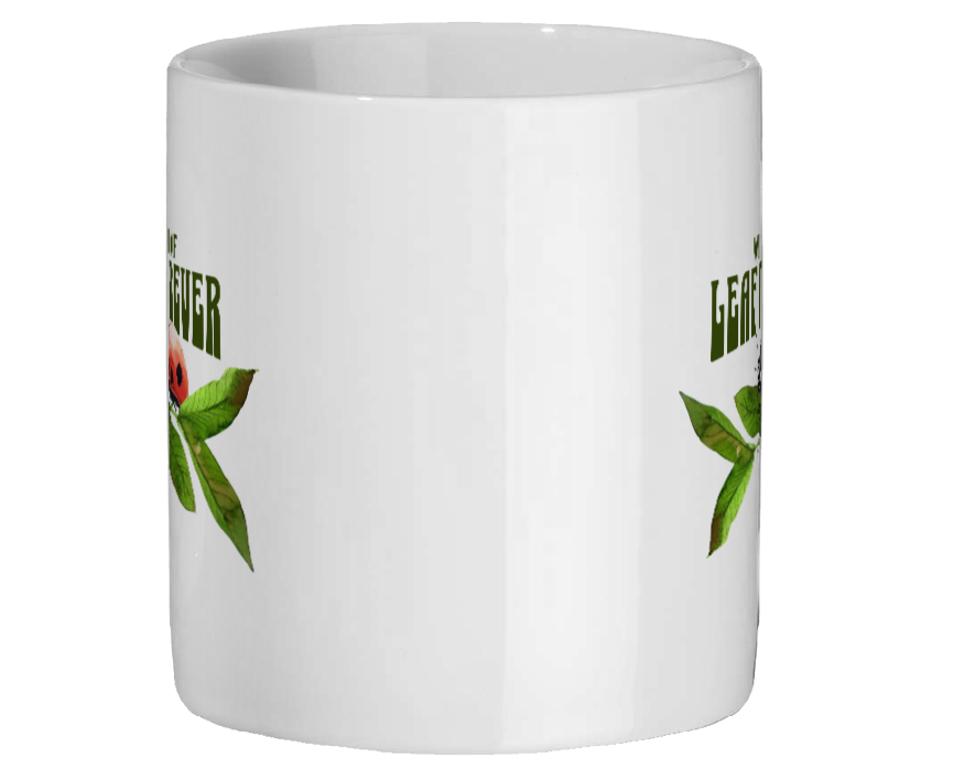 White mug with green text and graphics on a white background