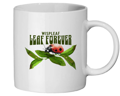 White mug with a design of a ladybug on a leaf and text 'Wispleaf Leaf Forever' on a white background